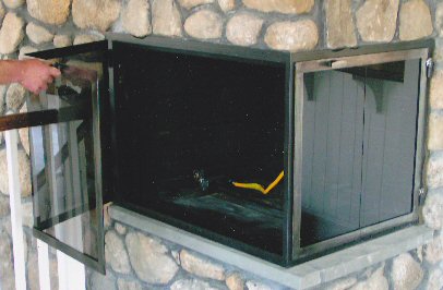 Falmouth square corner unit on stone fireplace black frame with natural iron bi fold doors